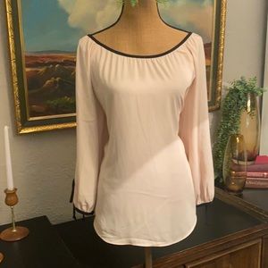 Blush and black blouse